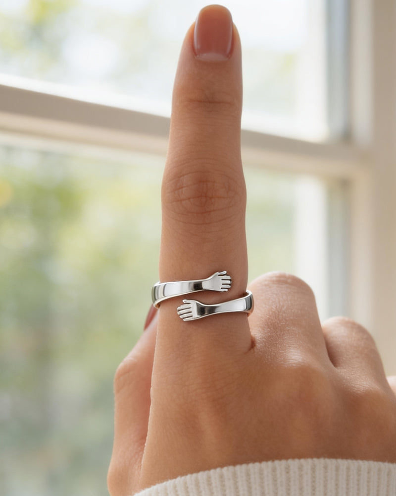 To My Mom Hug Ring in silver, two small hands hugging the finger
