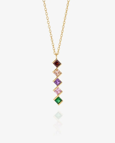 Gold Chapters birthstone necklace with square-set stones offset in a vertical drop, shown flat