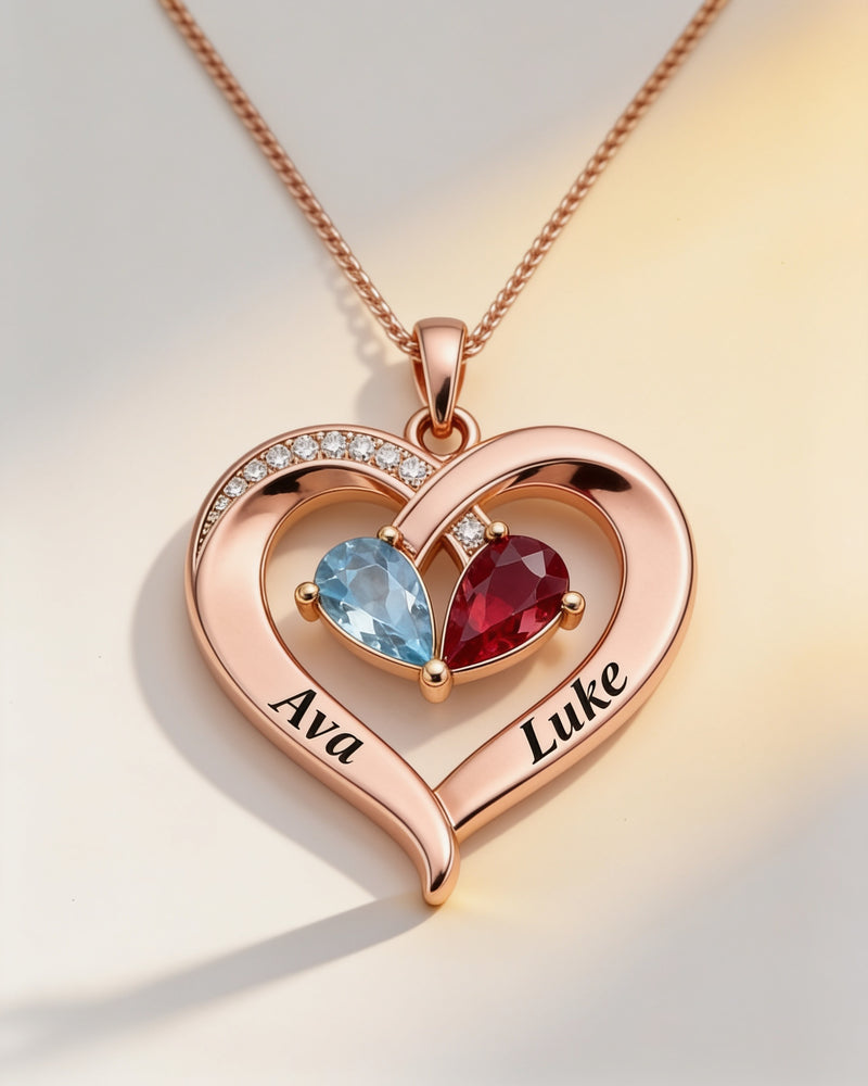 Engraved Names Birthstone Heart Necklace in rose gold with aquamarine and ruby birthstones, engraved Ava and Luke