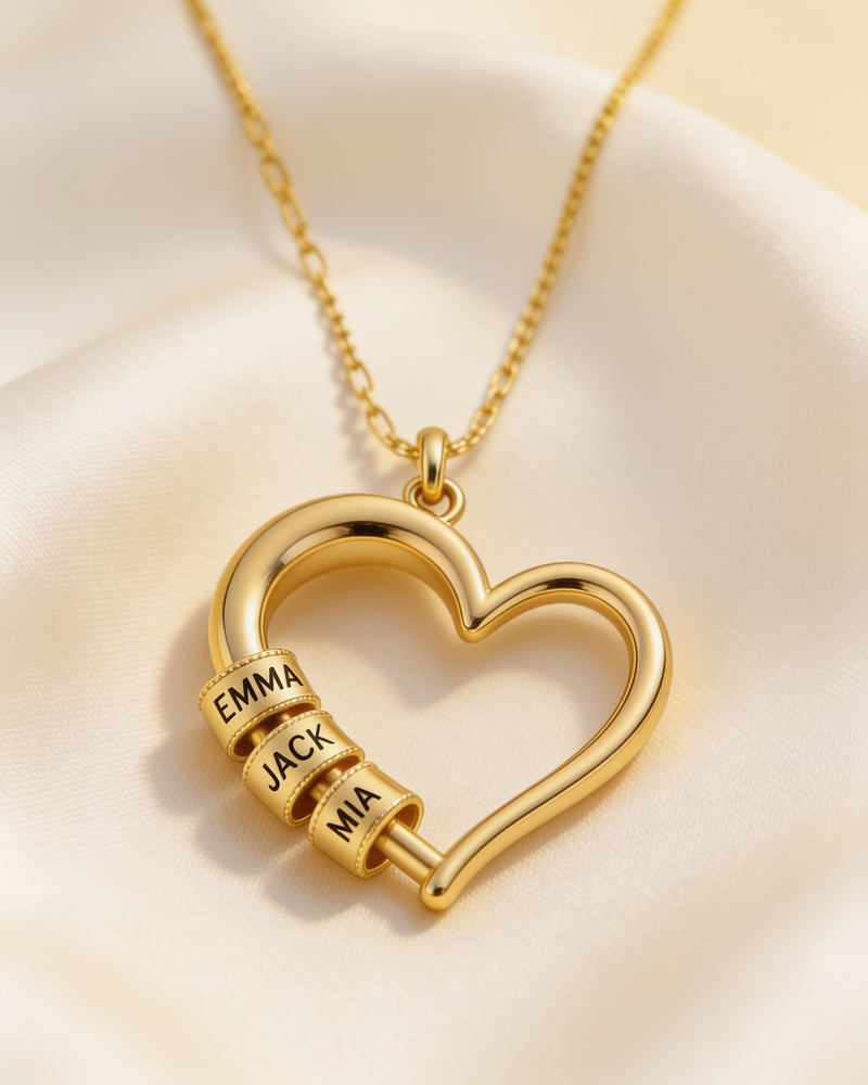 Heart of the Family Name Bead Necklace in gold with three engraved name beads, Emma, Jack and Mia