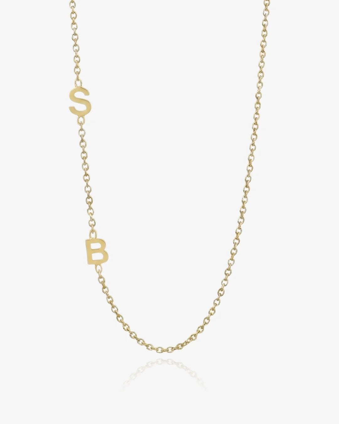 Gold sideways initial necklace, celebrity personalized jewelry trend