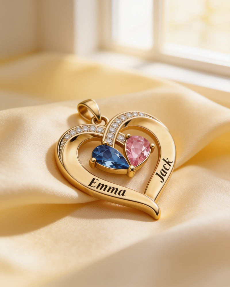 Close-up of the engraved names Emma and Jack on the gold birthstone heart pendant