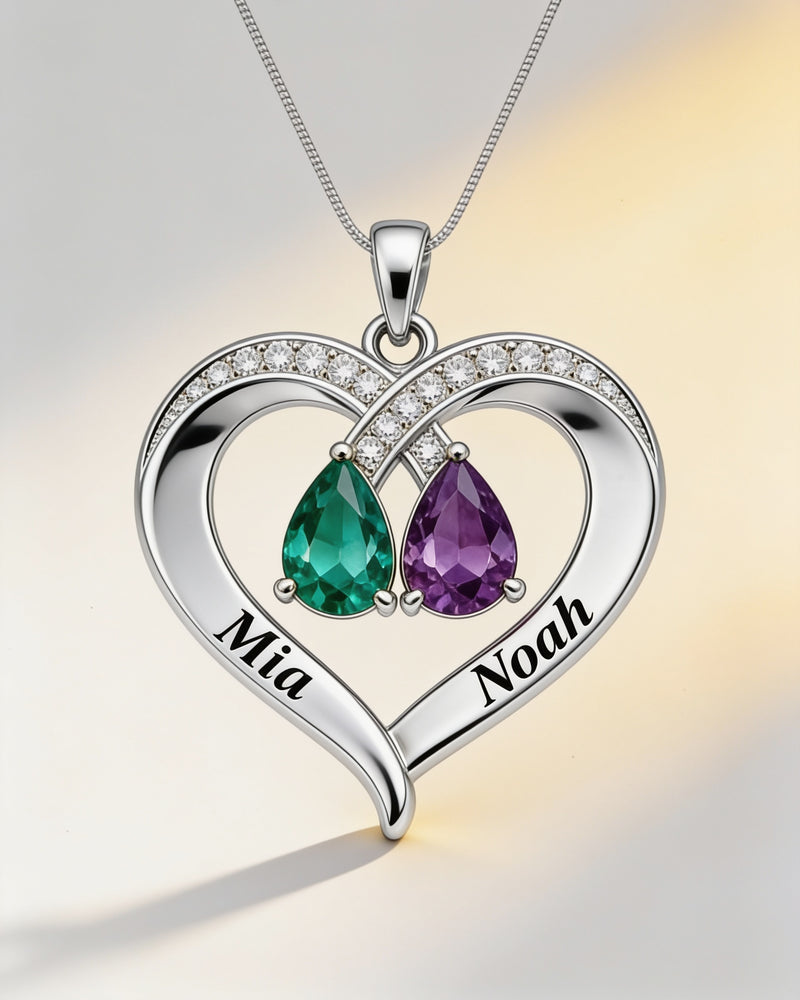 Engraved Names Birthstone Heart Necklace in silver with emerald and amethyst birthstones, engraved Mia and Noah