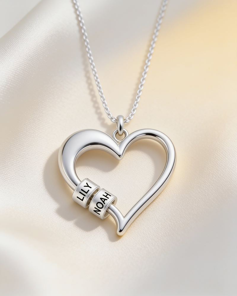 Heart of the Family Name Bead Necklace in silver with two engraved name beads, Lily and Noah