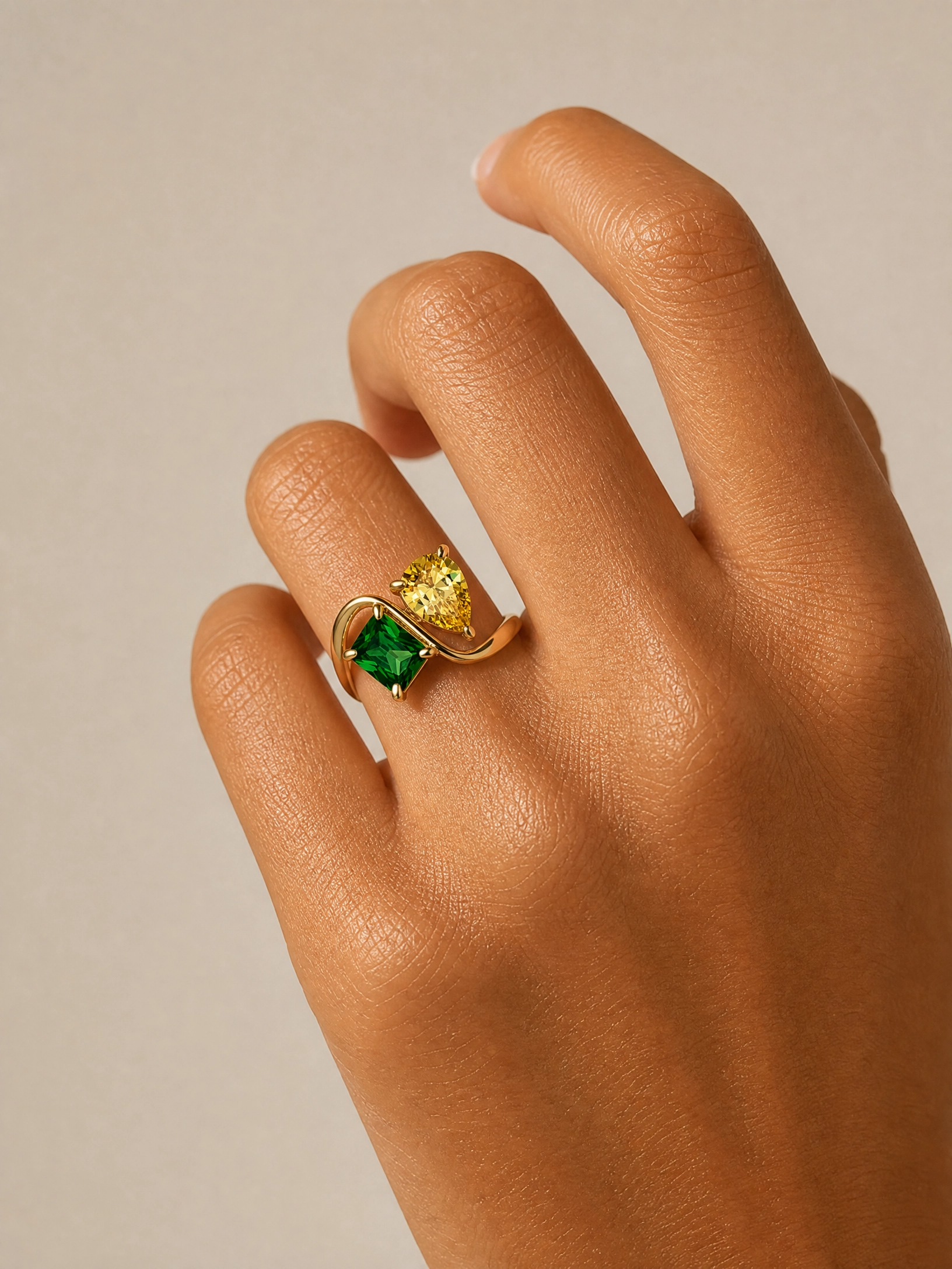 Two-birthstone ring worn on the hand — a personalized mother's and family ring